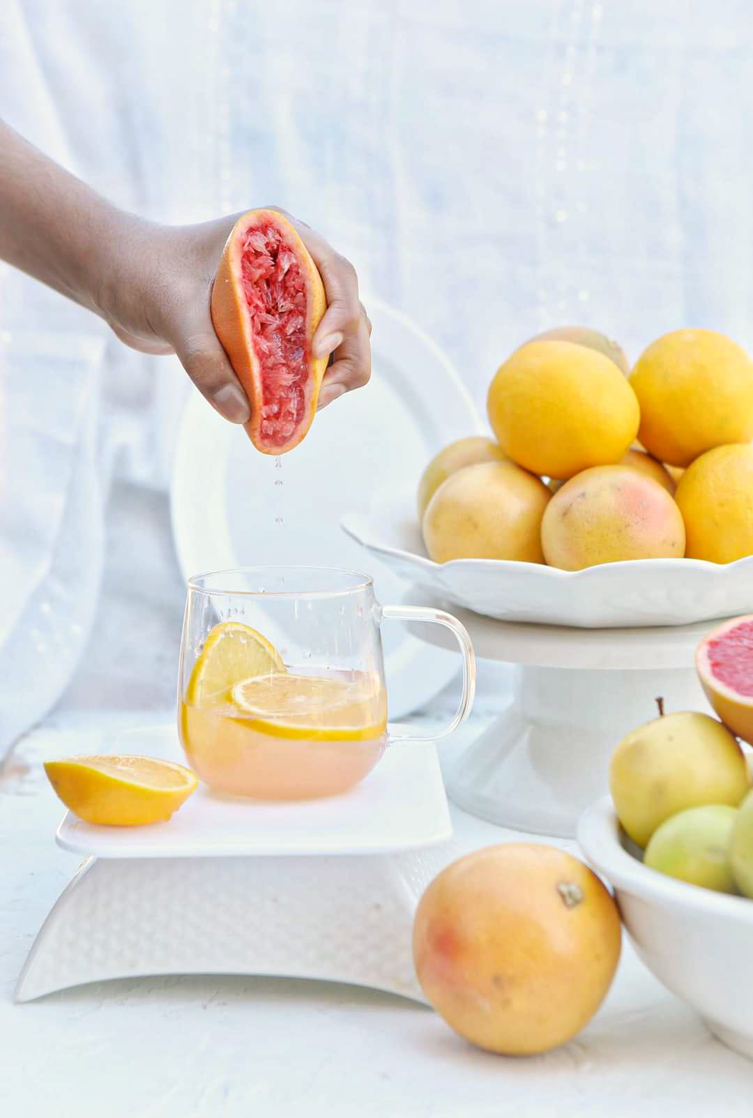 Person squeezing an orange